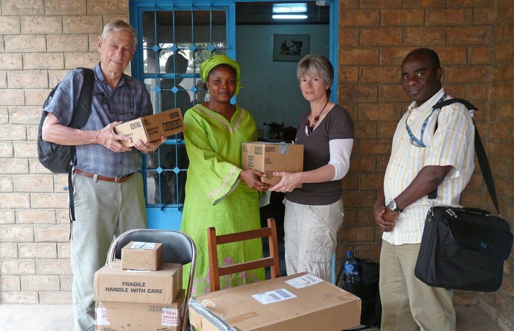 People unloading boxes of medicine