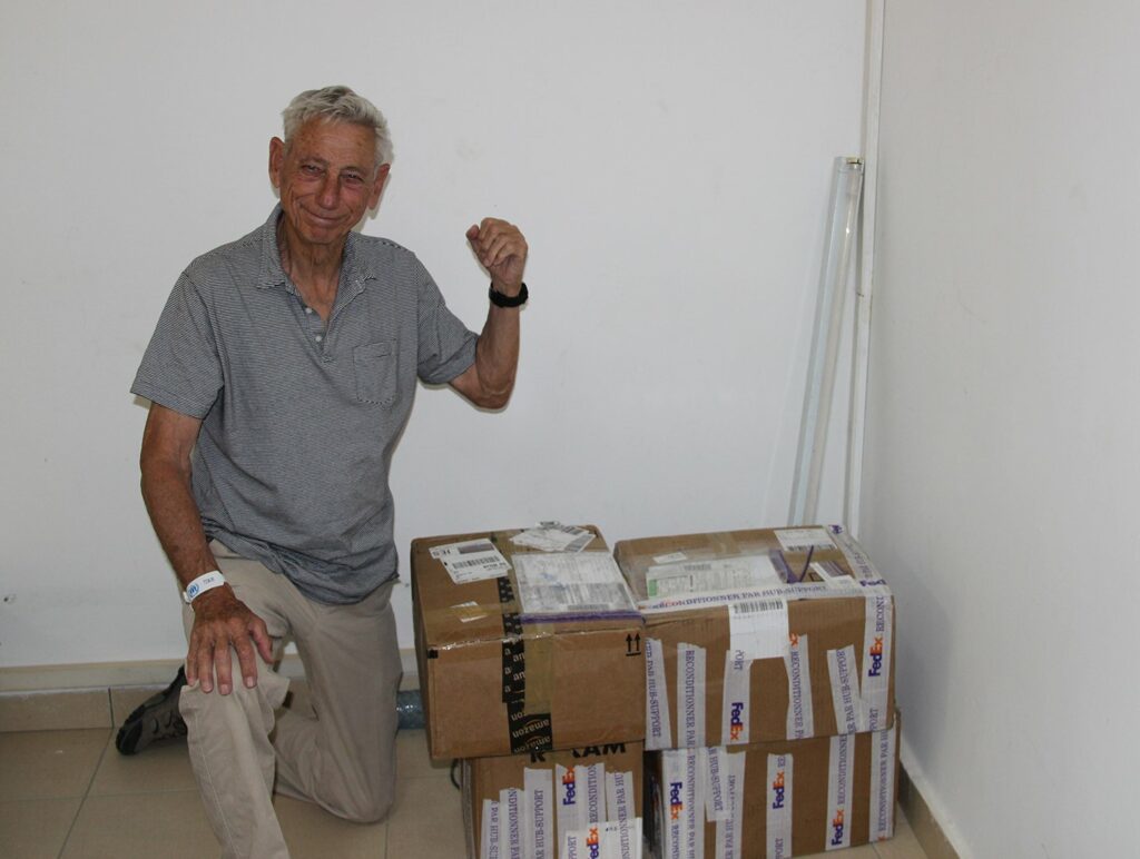 Man with boxes of medicine