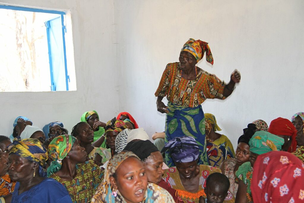Refugee speaking at CRF meeting