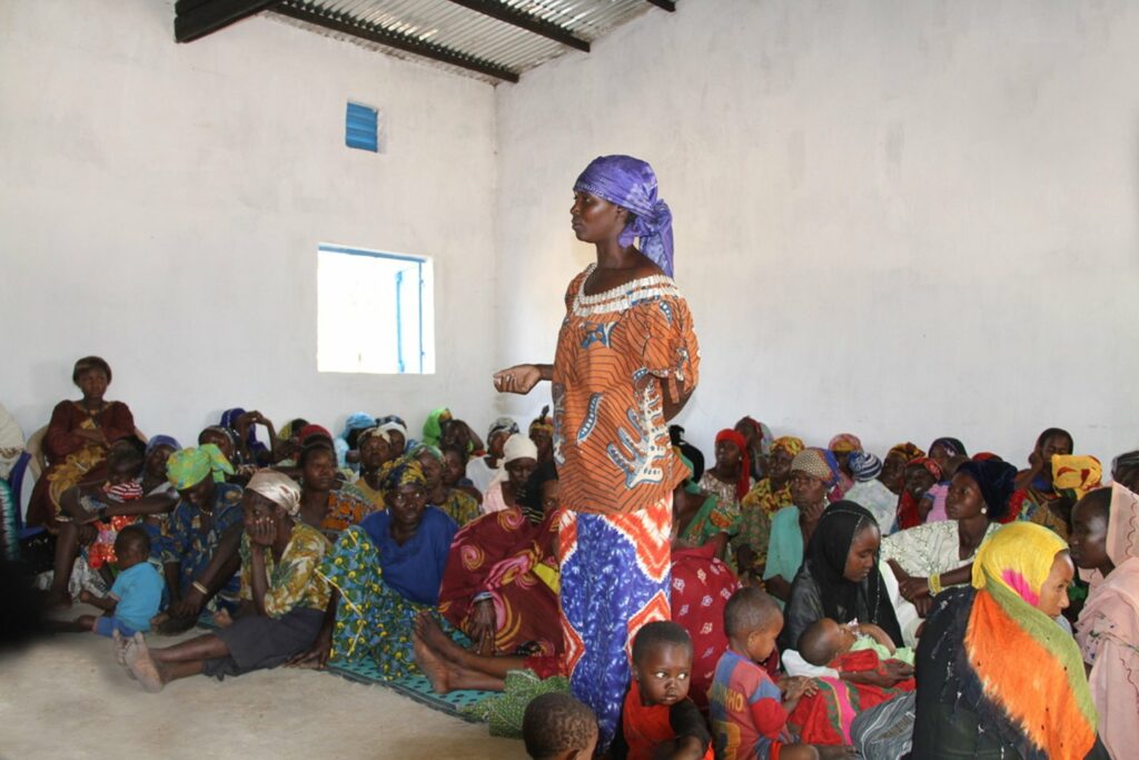 Refugee speaking at CRF meeting